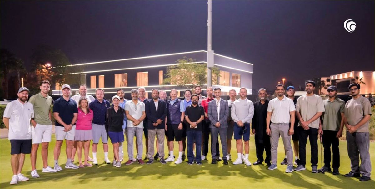 "FORE" Business Dubai members together on the green after a night golf event