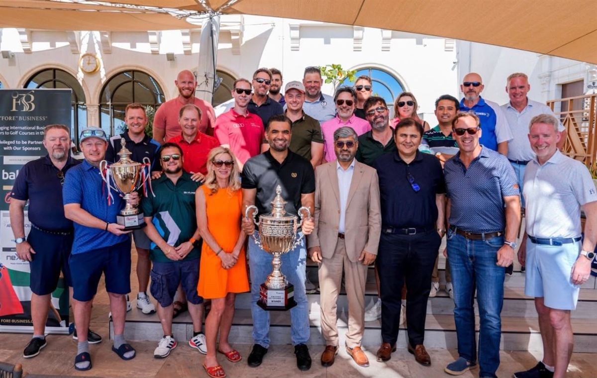 Members and guests gathered with the trophies at a prize giving